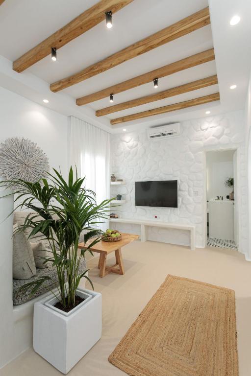 Televízia a/alebo spoločenská miestnosť v ubytovaní Kamvas Deluxe Apartments