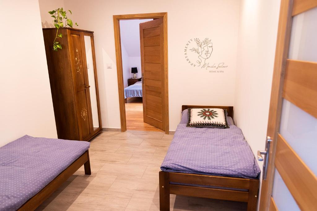Posteľ alebo postele v izbe v ubytovaní Apartamenty Home&Spa