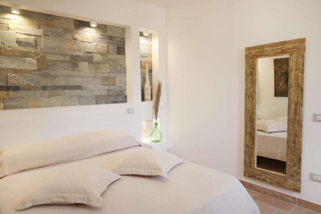 Ένα ή περισσότερα κρεβάτια σε δωμάτιο στο Borgo del Nespolo