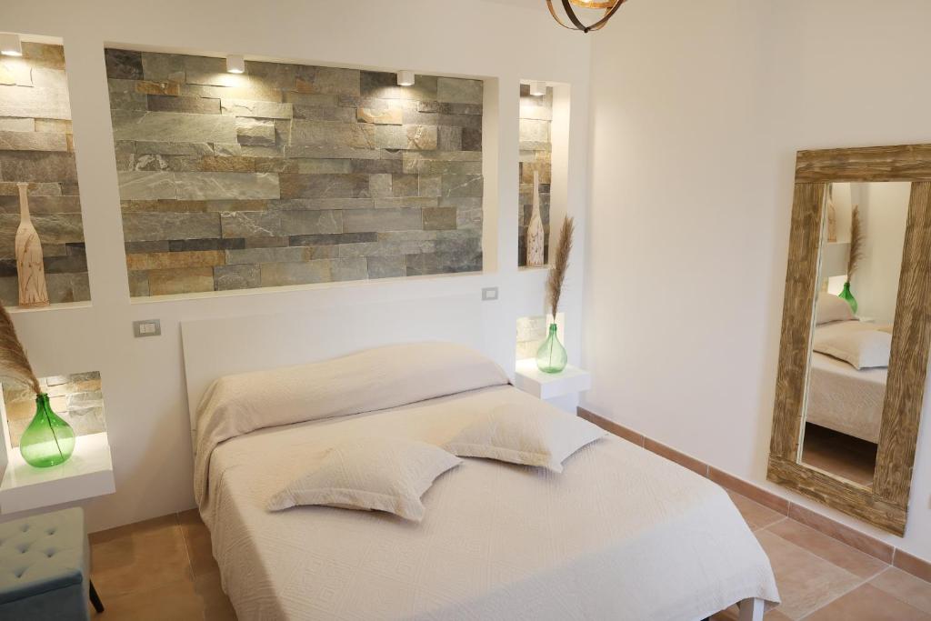 Ένα ή περισσότερα κρεβάτια σε δωμάτιο στο Borgo del Nespolo