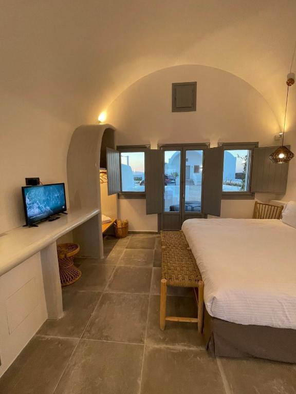 Postel nebo postele na pokoji v ubytování Anemi Vine Villas