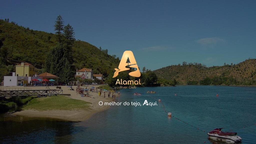 a sign on the side of a body of water at Alamal River Club in Gavião