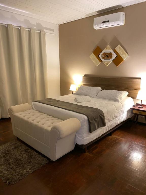 מיטה או מיטות בחדר ב-Hotel Pousada La Vierro