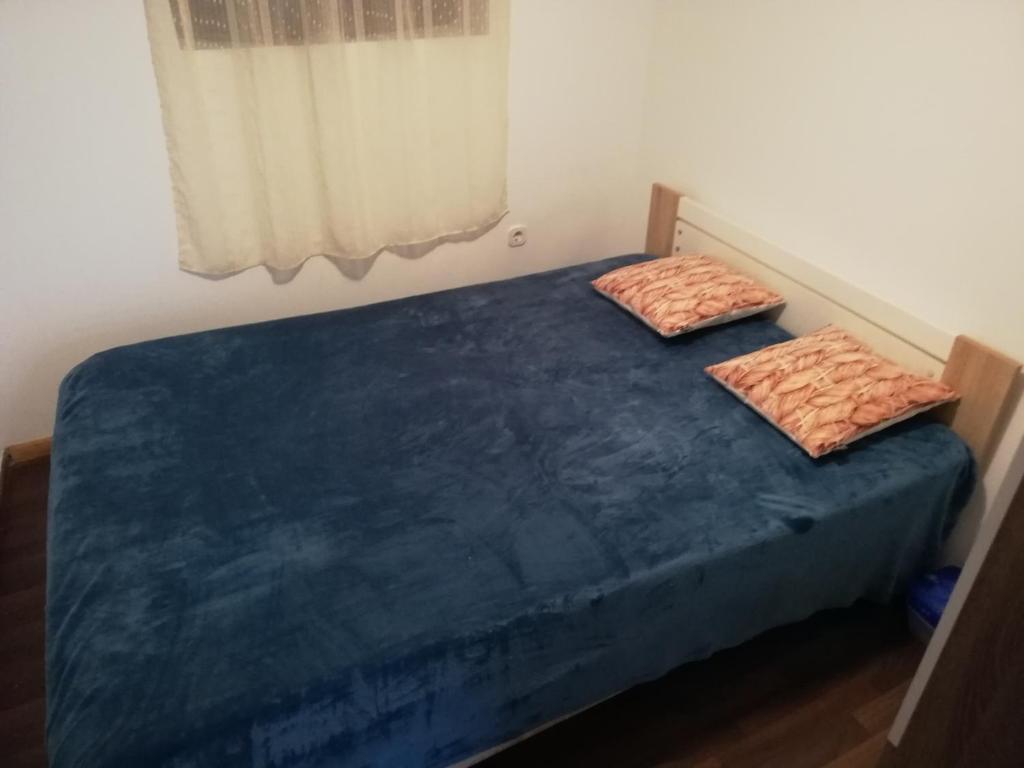 Posteľ alebo postele v izbe v ubytovaní Apartman Cvita