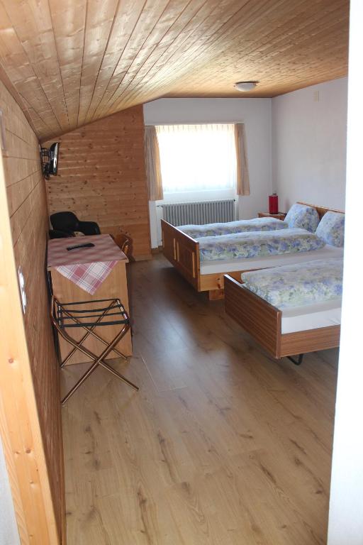 Postel nebo postele na pokoji v ubytování Hotel Posta