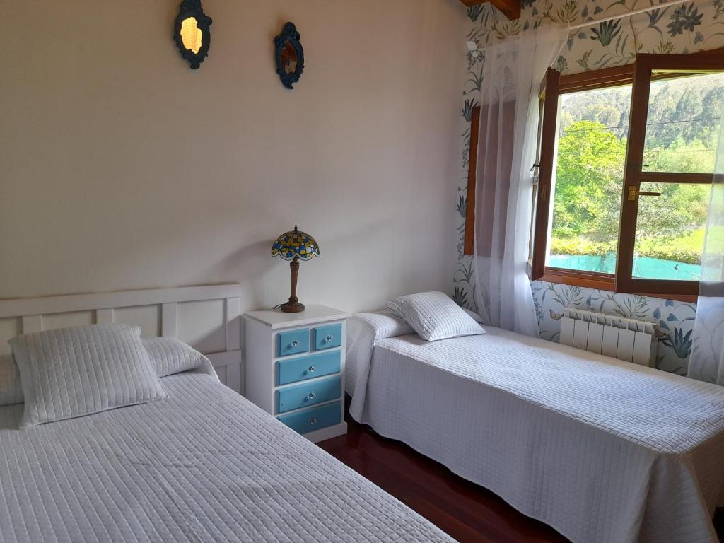 Postel nebo postele na pokoji v ubytování Gestiona2R - Casa con finca en Pendueles al lado de la playa