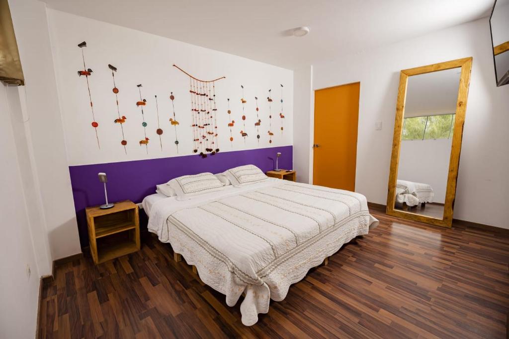 Postel nebo postele na pokoji v ubytování Casa Boutique QX- Pachacamac