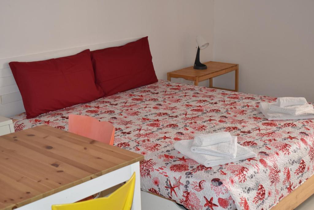 Posteľ alebo postele v izbe v ubytovaní atocà3 casa vacanze - vedi anche atocà1 e atocà2