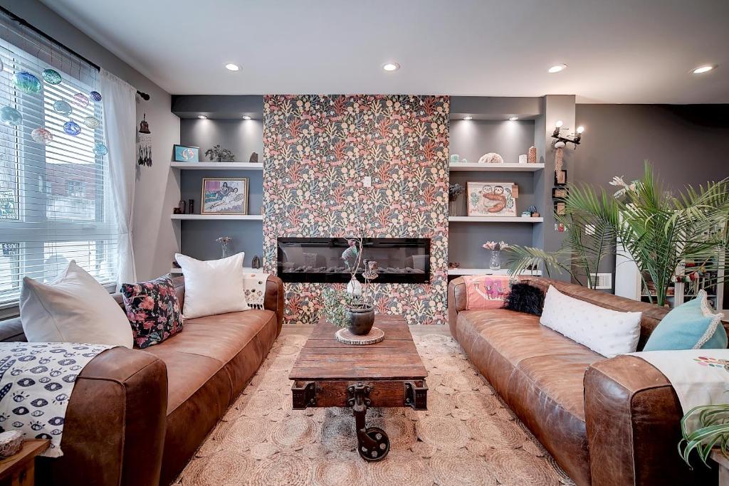 a living room with a couch and a fireplace at Artsy Hidden Gem ll -Free Parking -- in Philadelphia