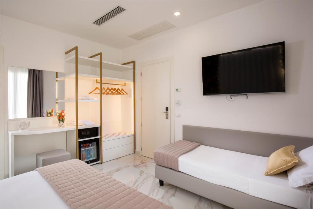 Postel nebo postele na pokoji v ubytování Hotel Cenisio