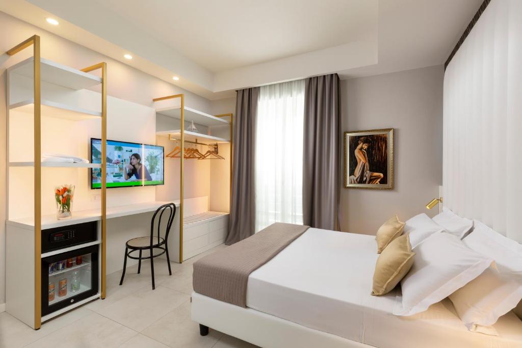 Postel nebo postele na pokoji v ubytování Hotel Cenisio