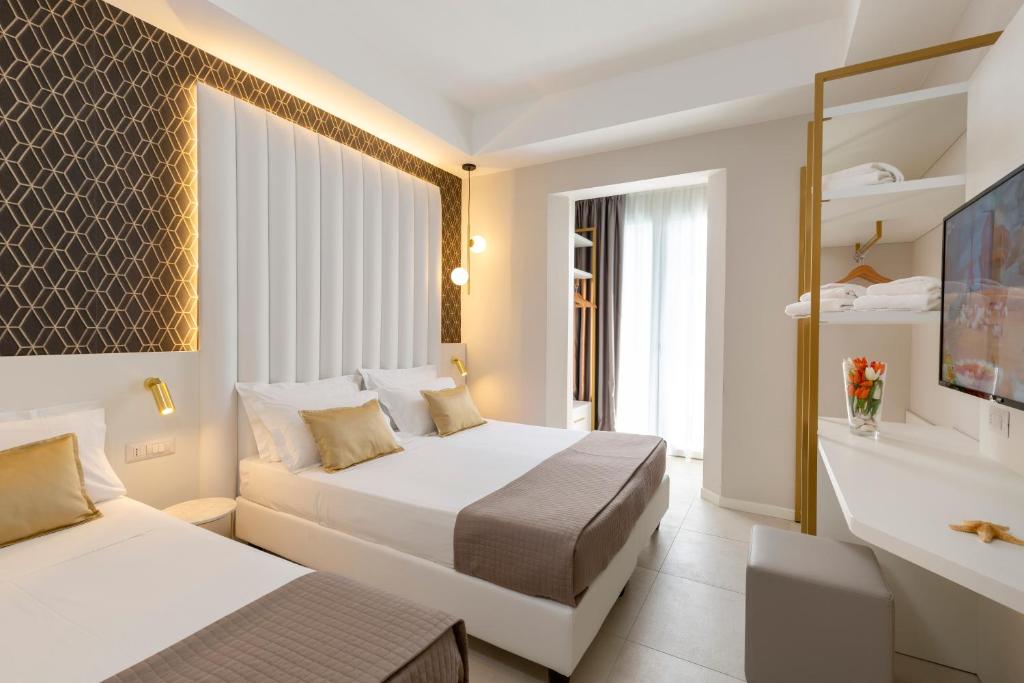 Postel nebo postele na pokoji v ubytování Hotel Cenisio