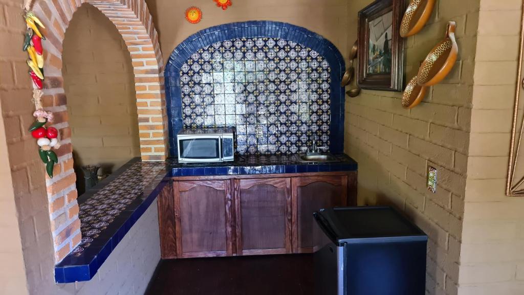 Kuchyň nebo kuchyňský kout v ubytování Quinta Tere Hotel & Gallery