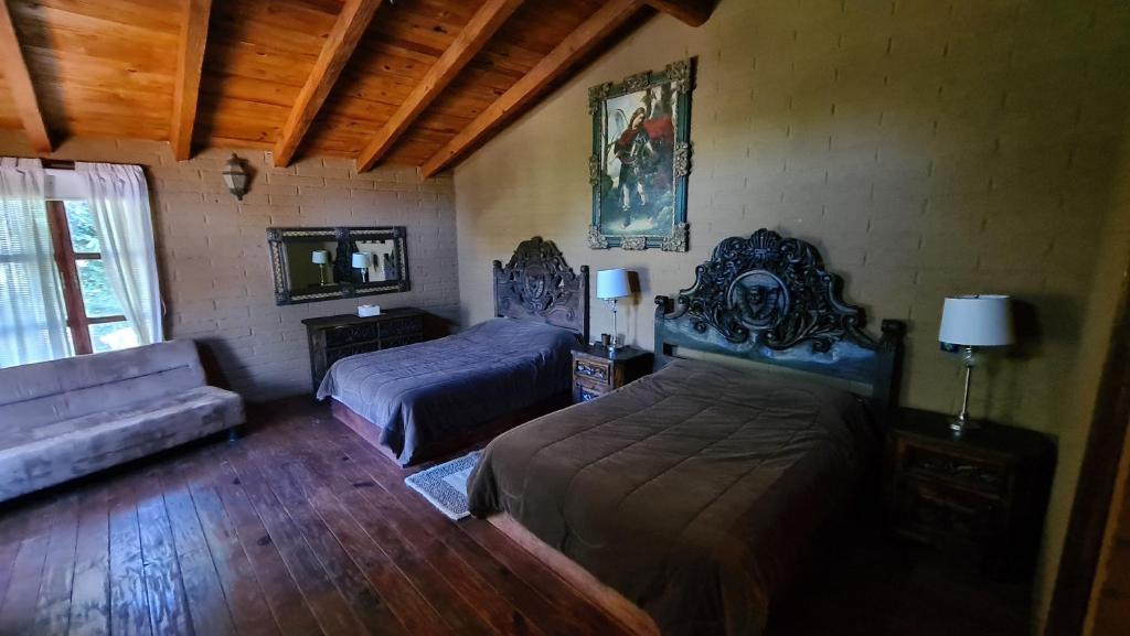 Postel nebo postele na pokoji v ubytování Quinta Tere Hotel & Gallery