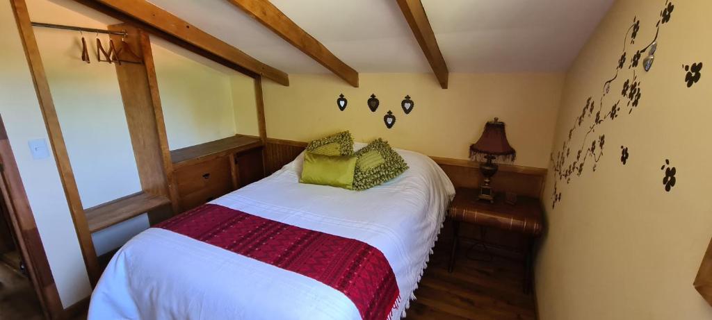 Postel nebo postele na pokoji v ubytování Quinta Tere Hotel & Gallery