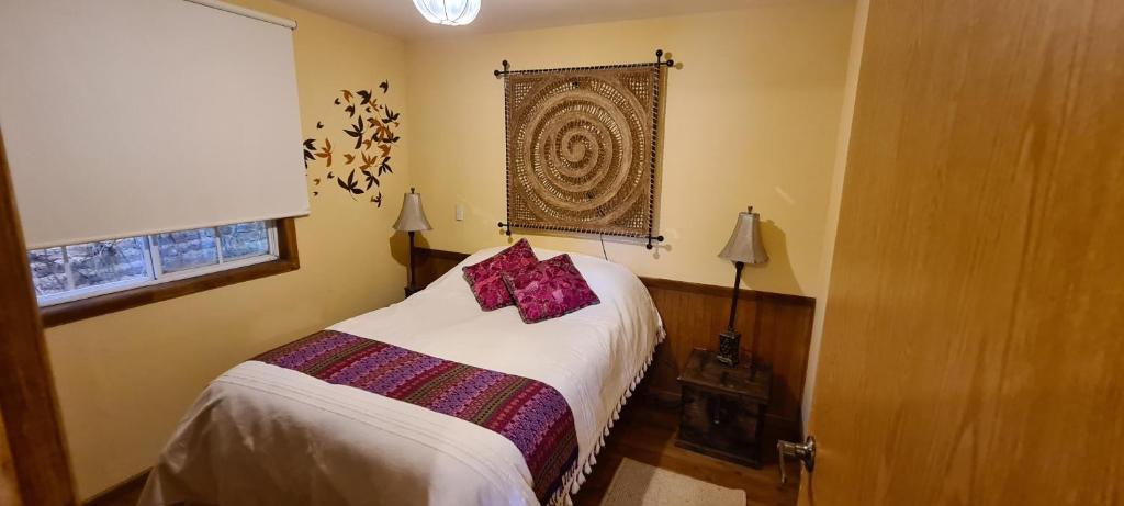 Postel nebo postele na pokoji v ubytování Quinta Tere Hotel & Gallery
