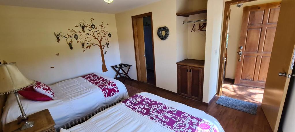 Postel nebo postele na pokoji v ubytování Quinta Tere Hotel & Gallery