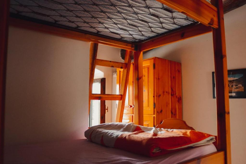 Postel nebo postele na pokoji v ubytování Rifugio Baita Fos-Ce