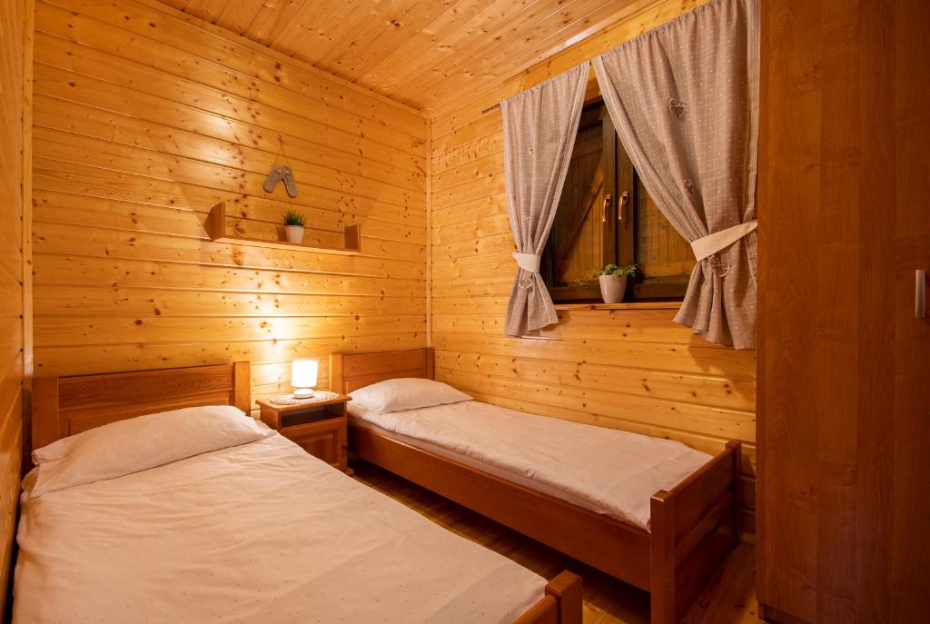 Postel nebo postele na pokoji v ubytování Domki Pasat