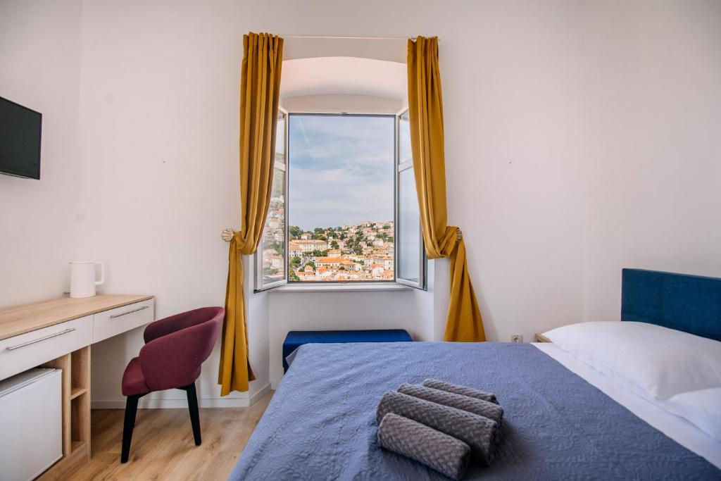 Posteľ alebo postele v izbe v ubytovaní ART DECO DUBROVNIK ROOMS by DuHomes
