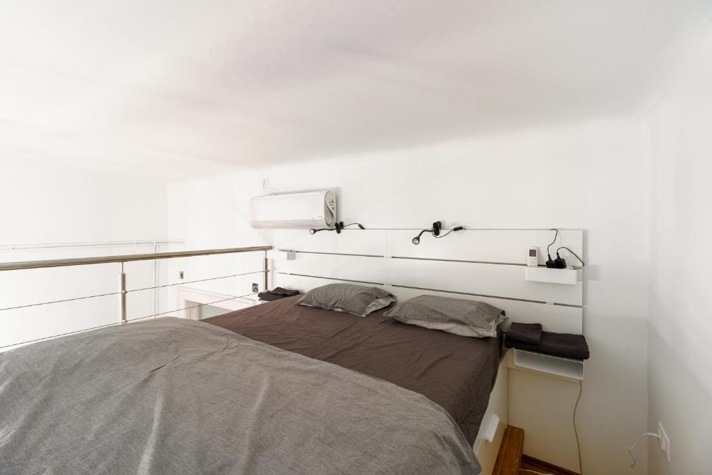 Posteľ alebo postele v izbe v ubytovaní Central Loft-style flat next to Danube