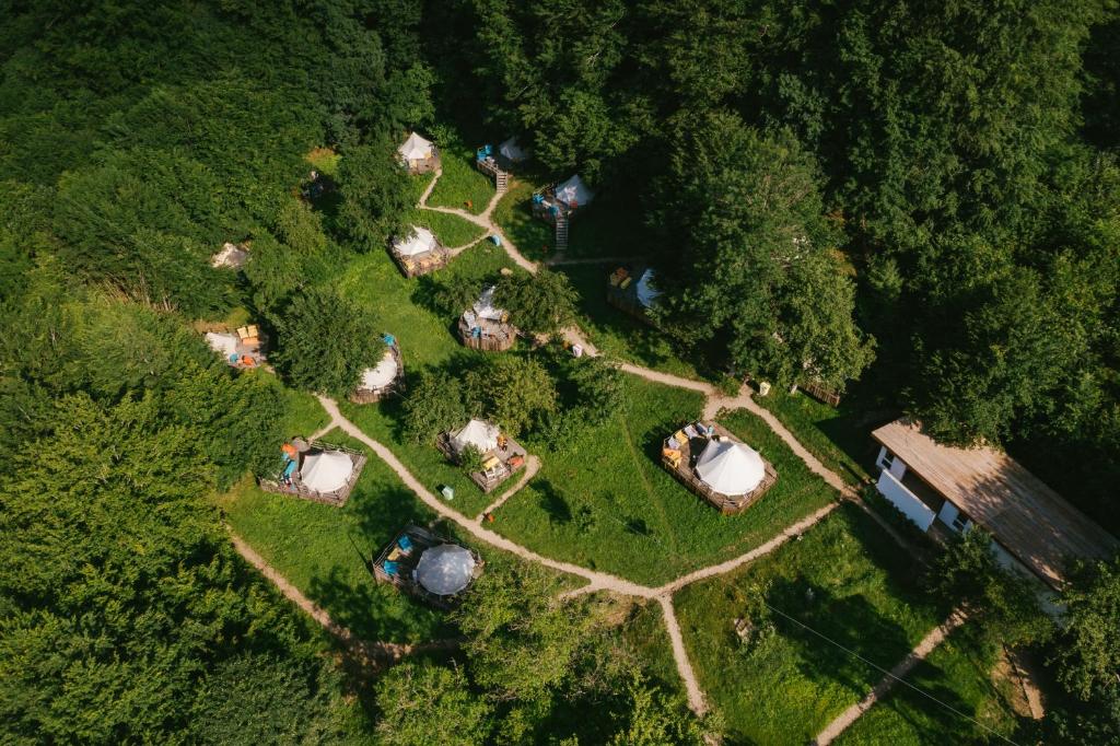 an overhead view of a park with tents and trees at Green Camp - Adventure Glamping in Gura Teghii