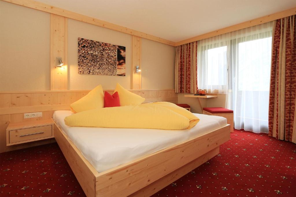 a bedroom with a large bed in a room at Haus Stefanie in Sölden