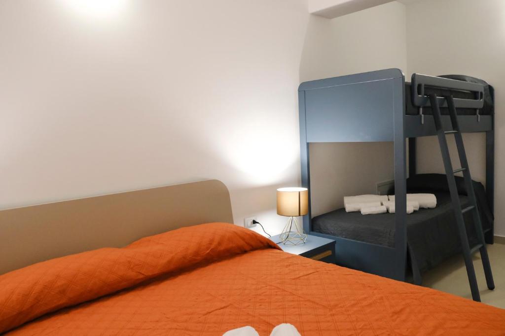 Postel nebo postele na pokoji v ubytování SOL Y MAR Camere e Appartamenti