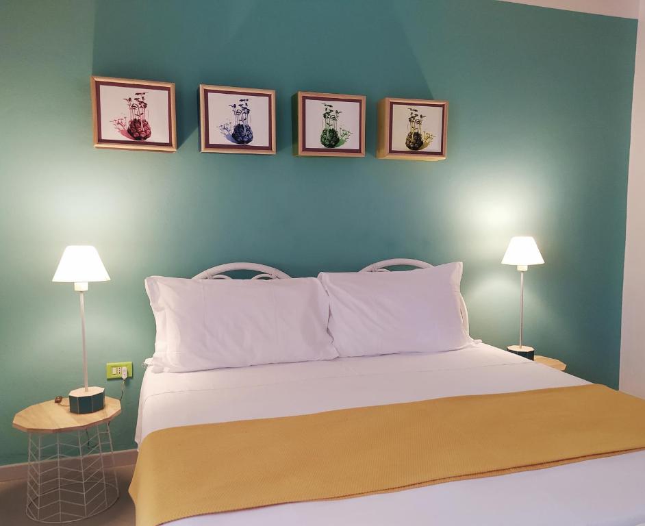 Postel nebo postele na pokoji v ubytování Hotel Galman