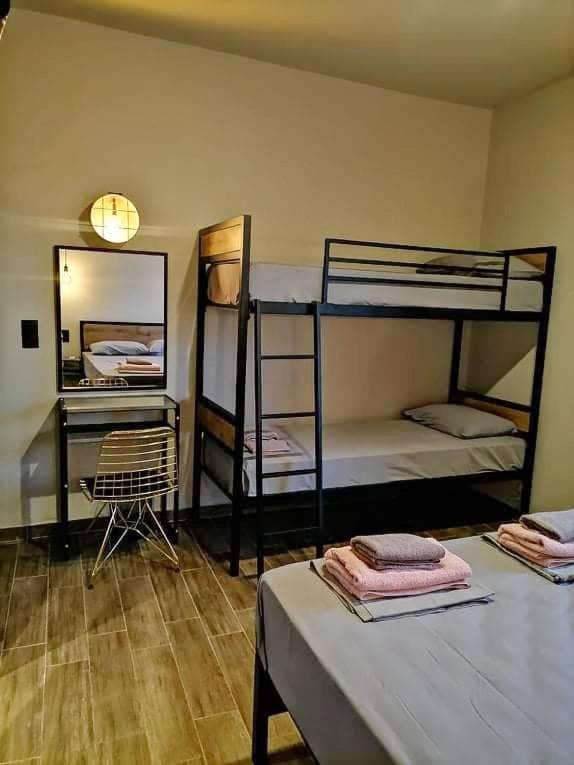 Postel nebo postele na pokoji v ubytování Grecos ART SKIATHOS
