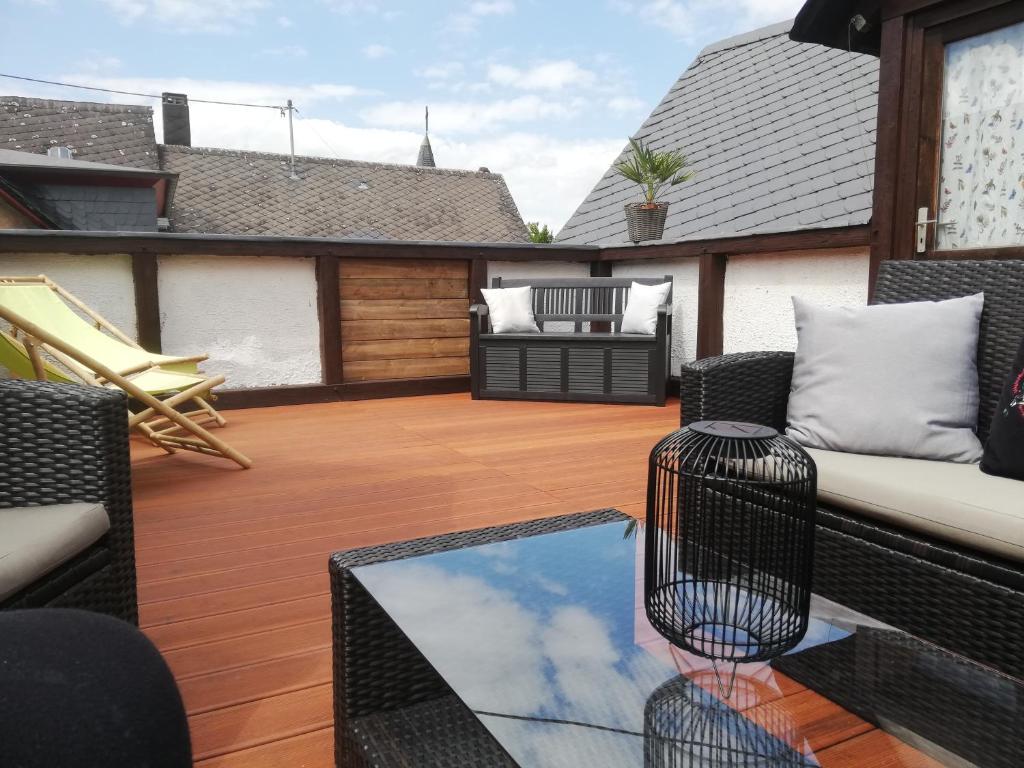 an outdoor patio with a couch and a table at Casa De Oro in Ellenz-Poltersdorf