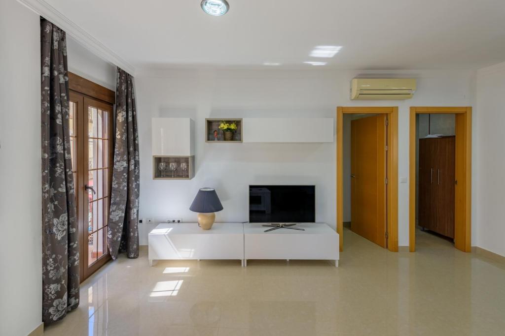 Televízia a/alebo spoločenská miestnosť v ubytovaní Apartamento Céntrico Sibarys - 2 dormitorios- Calle Pintada
