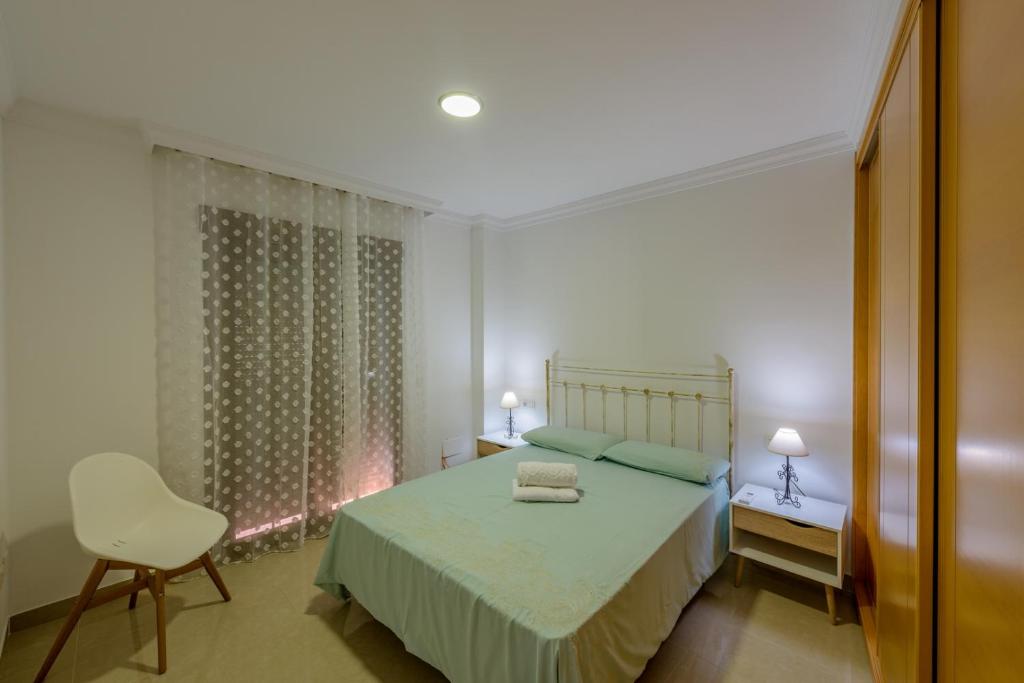 Posteľ alebo postele v izbe v ubytovaní Apartamento Céntrico Sibarys - 2 dormitorios- Calle Pintada