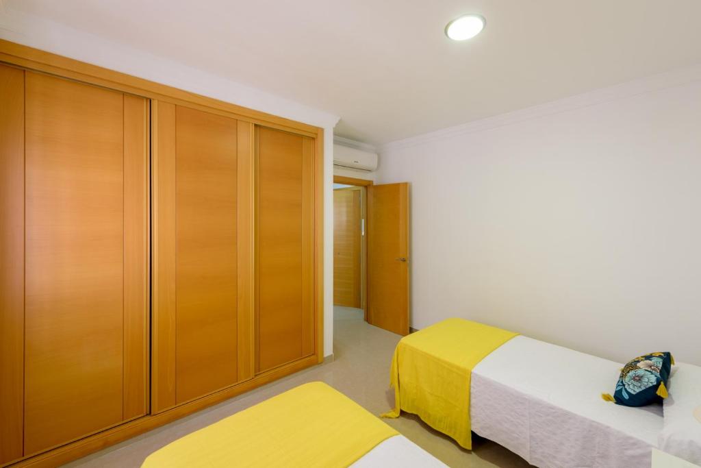 Posteľ alebo postele v izbe v ubytovaní Apartamento Céntrico Sibarys - 2 dormitorios- Calle Pintada