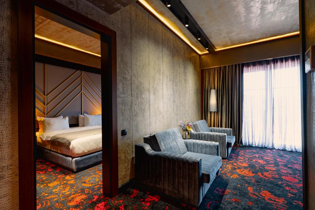 Postel nebo postele na pokoji v ubytování Tapis Rouge Design Boutique Hotel
