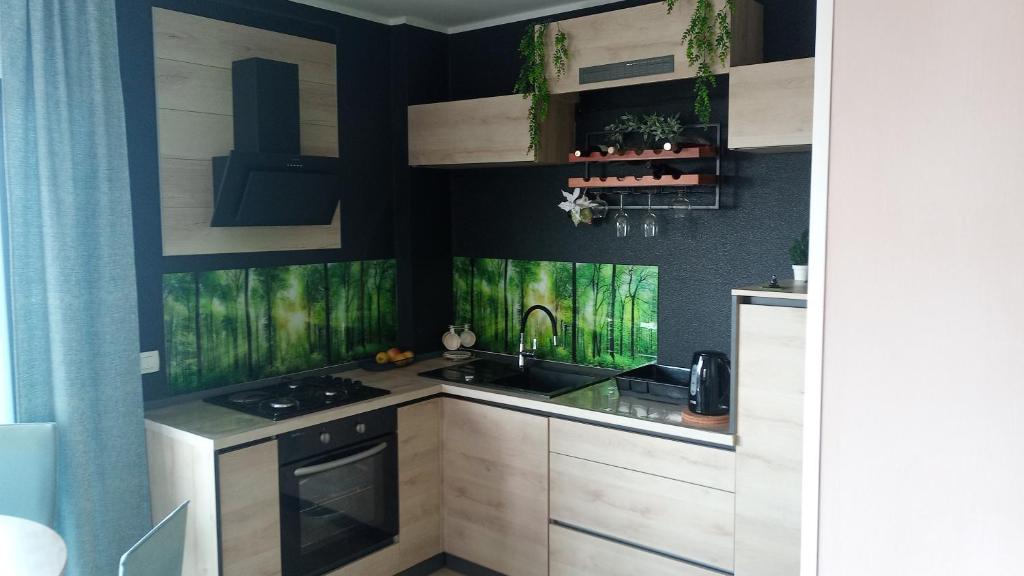 a kitchen with wooden cabinets and a sink at Luxor4 in Kaštela