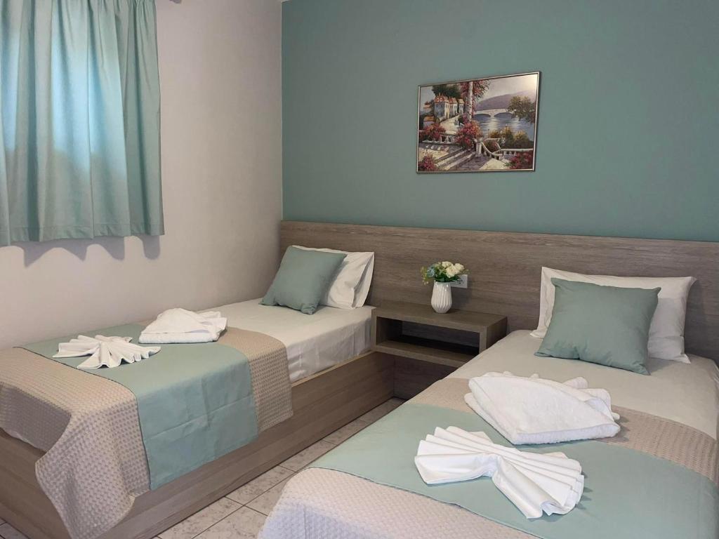 Postel nebo postele na pokoji v ubytování Asteras Apartments