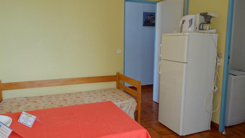 Kuchyň nebo kuchyňský kout v ubytování Residence Funtanella