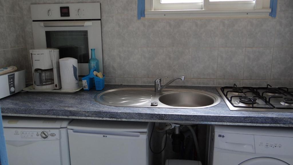 Kuchyň nebo kuchyňský kout v ubytování Residence Funtanella