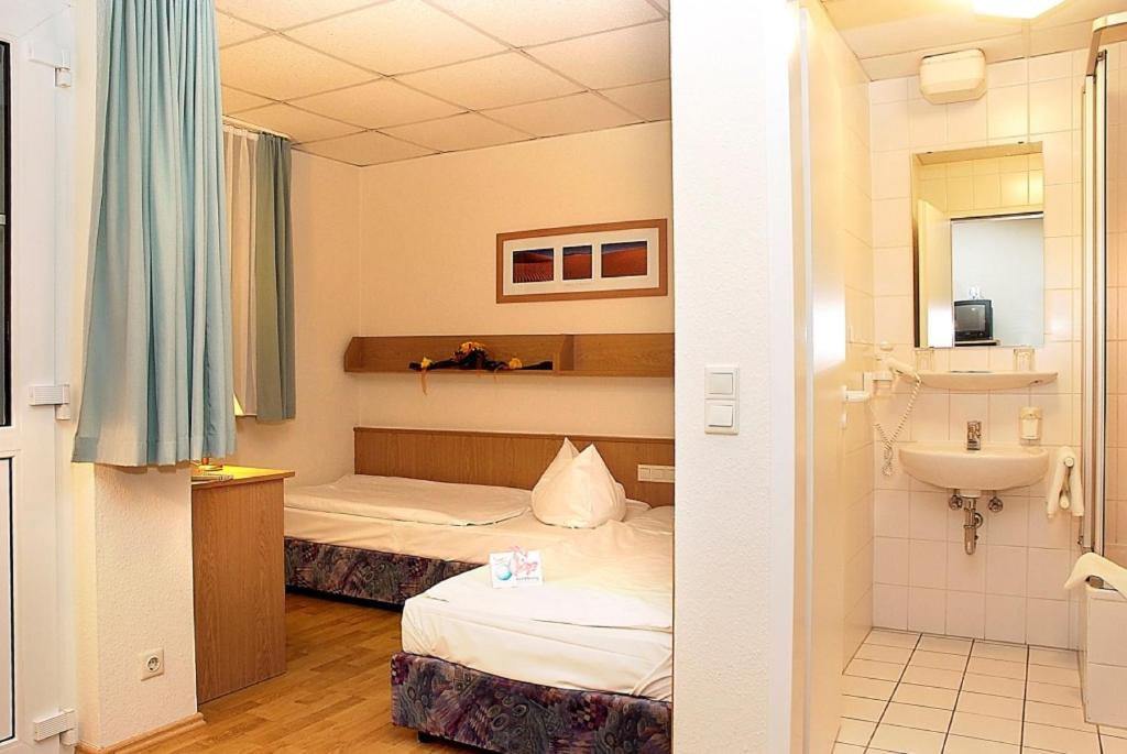 Voodi või voodid majutusasutuse Jembo Park Hotel toas