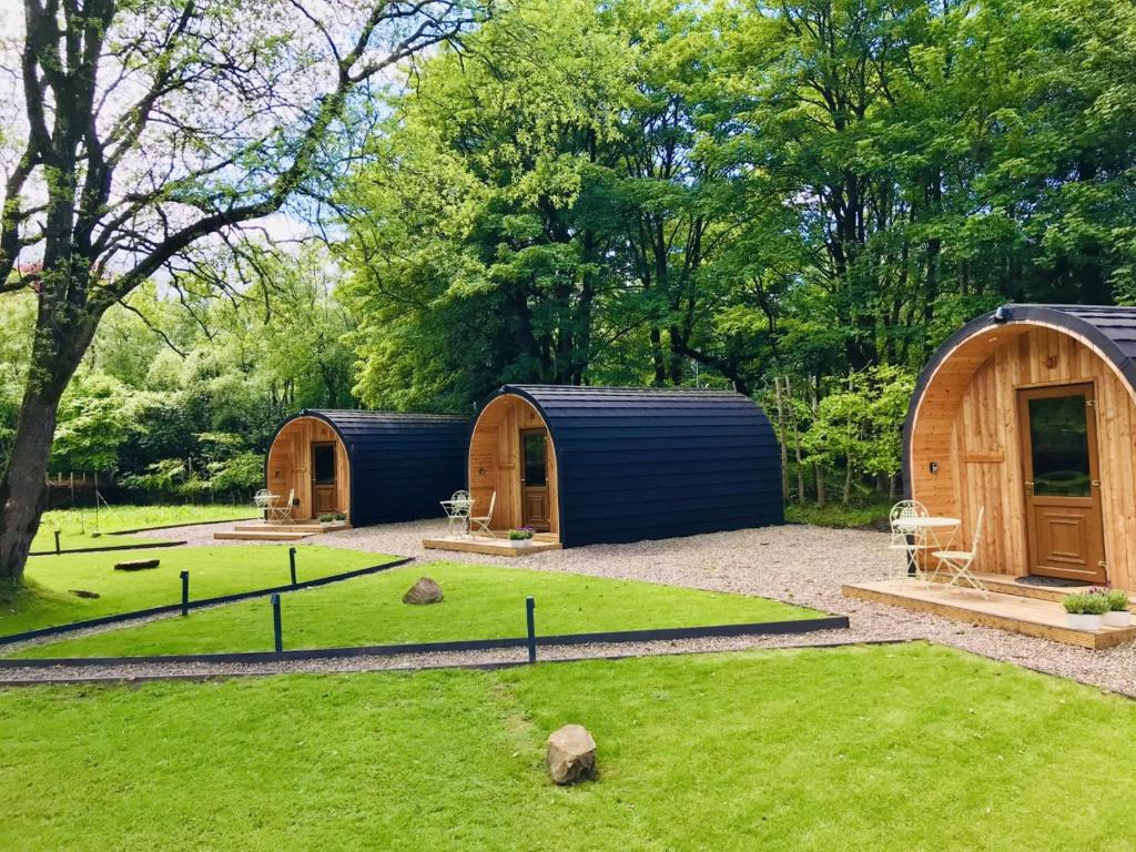 a group of three tents in a garden at Wilding on a Whim in West Linton