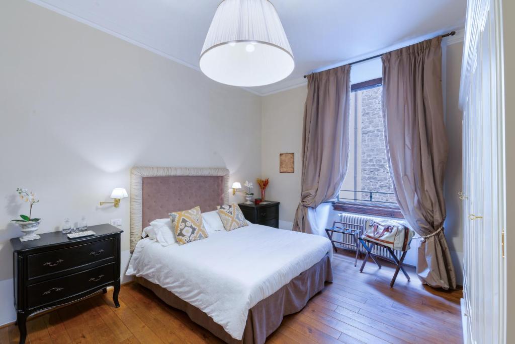 Ένα ή περισσότερα κρεβάτια σε δωμάτιο στο Caterina apartment