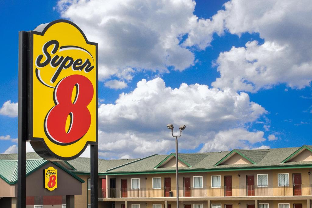 a sign for a super restaurant in front of a building at Super 8 by Wyndham Fox Creek in Fox Creek
