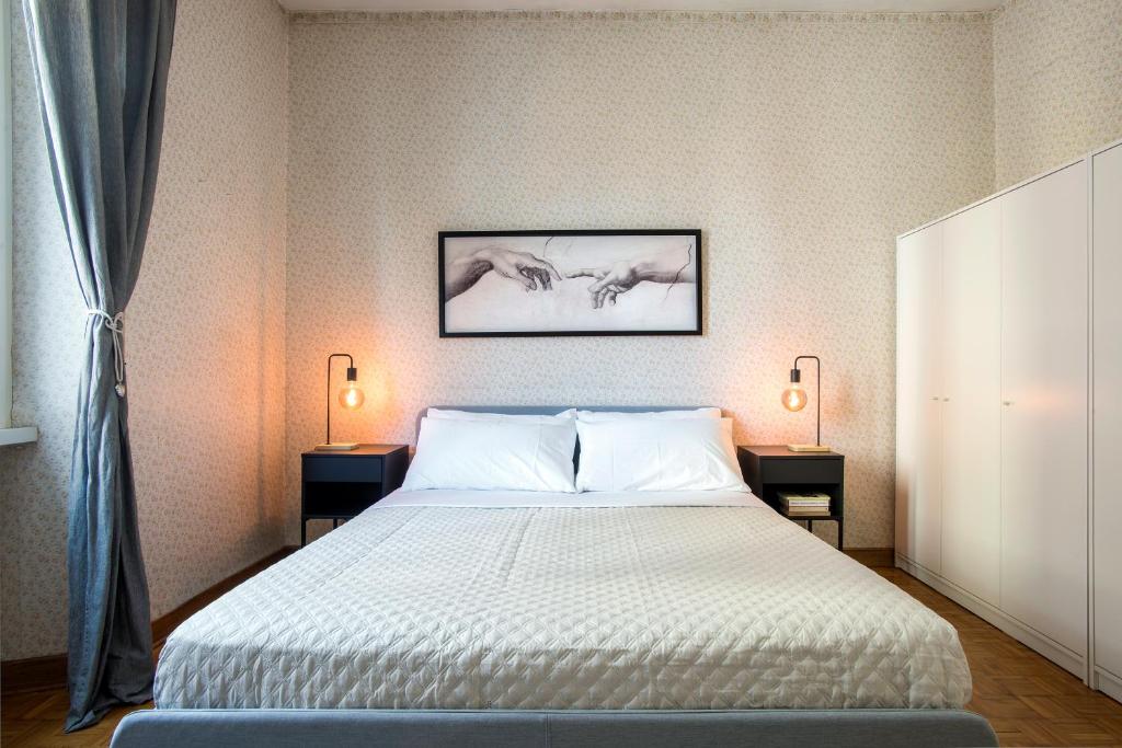 Postel nebo postele na pokoji v ubytování Art Of Living - Suite elegante nel cuore di Roma