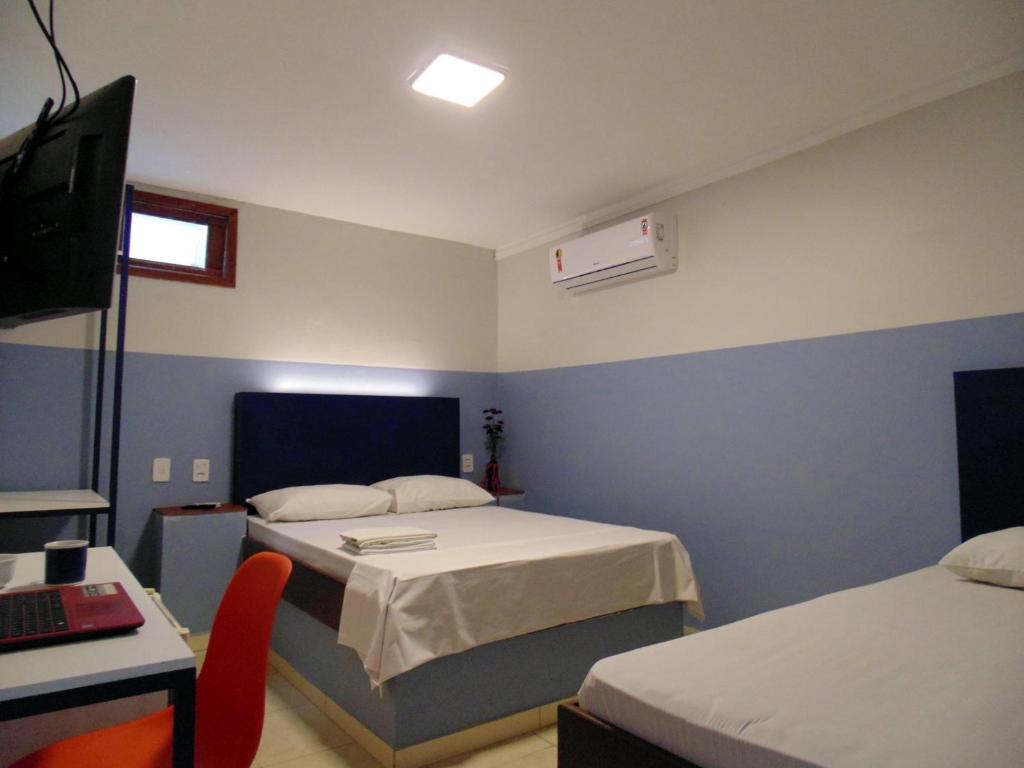 Postel nebo postele na pokoji v ubytování FAROL BEACH Suítes