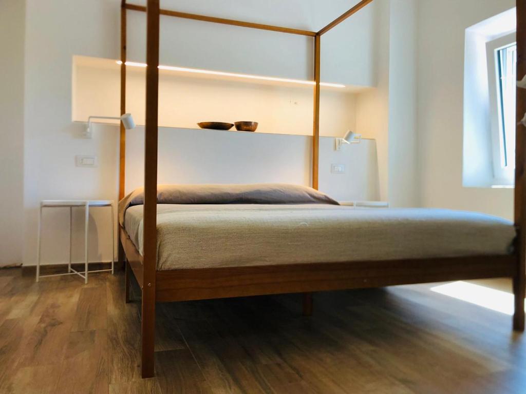 Ліжко або ліжка в номері ARCADIA - SIROLO
