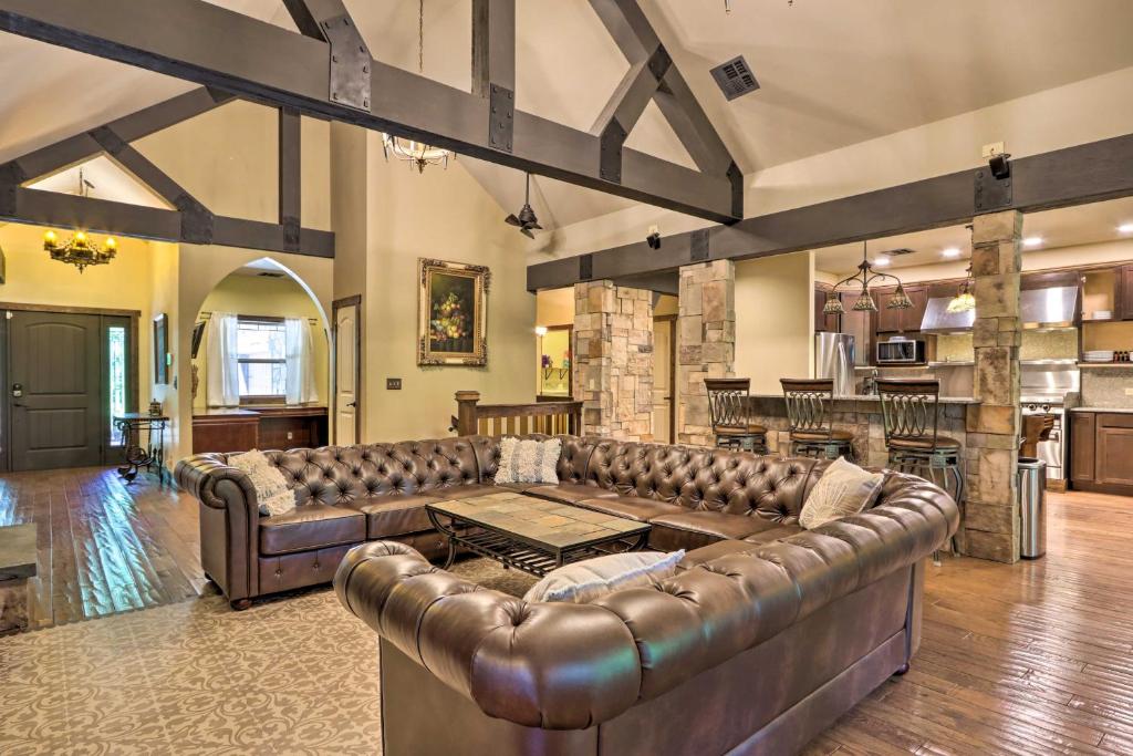 a living room with a couch and a table at Dragon Castle with Secret Passage, Dock, and Hot Tub in Camdenton