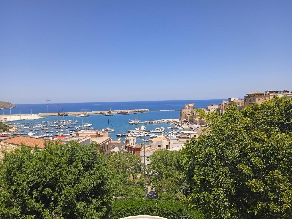 a view of a city with boats in the water at Mary Gery's Rooms in Castellammare del Golfo