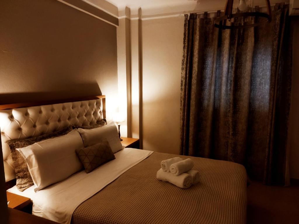 Posteľ alebo postele v izbe v ubytovaní Cozy Apartment in the Heart of Thessaloniki