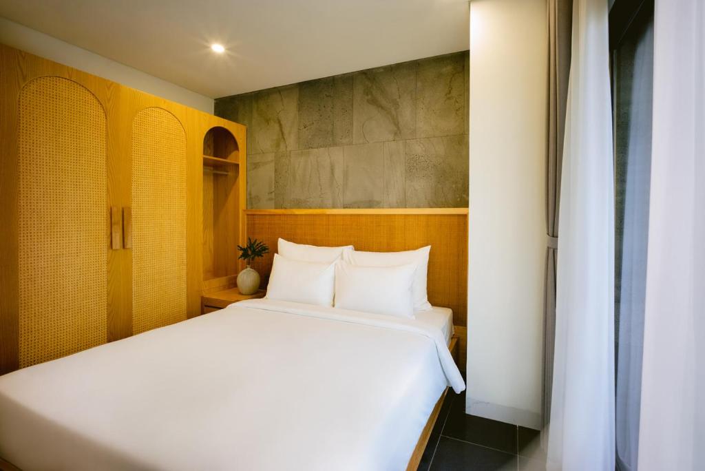 Giường trong phòng chung tại LIVIE Da Nang An Thuong